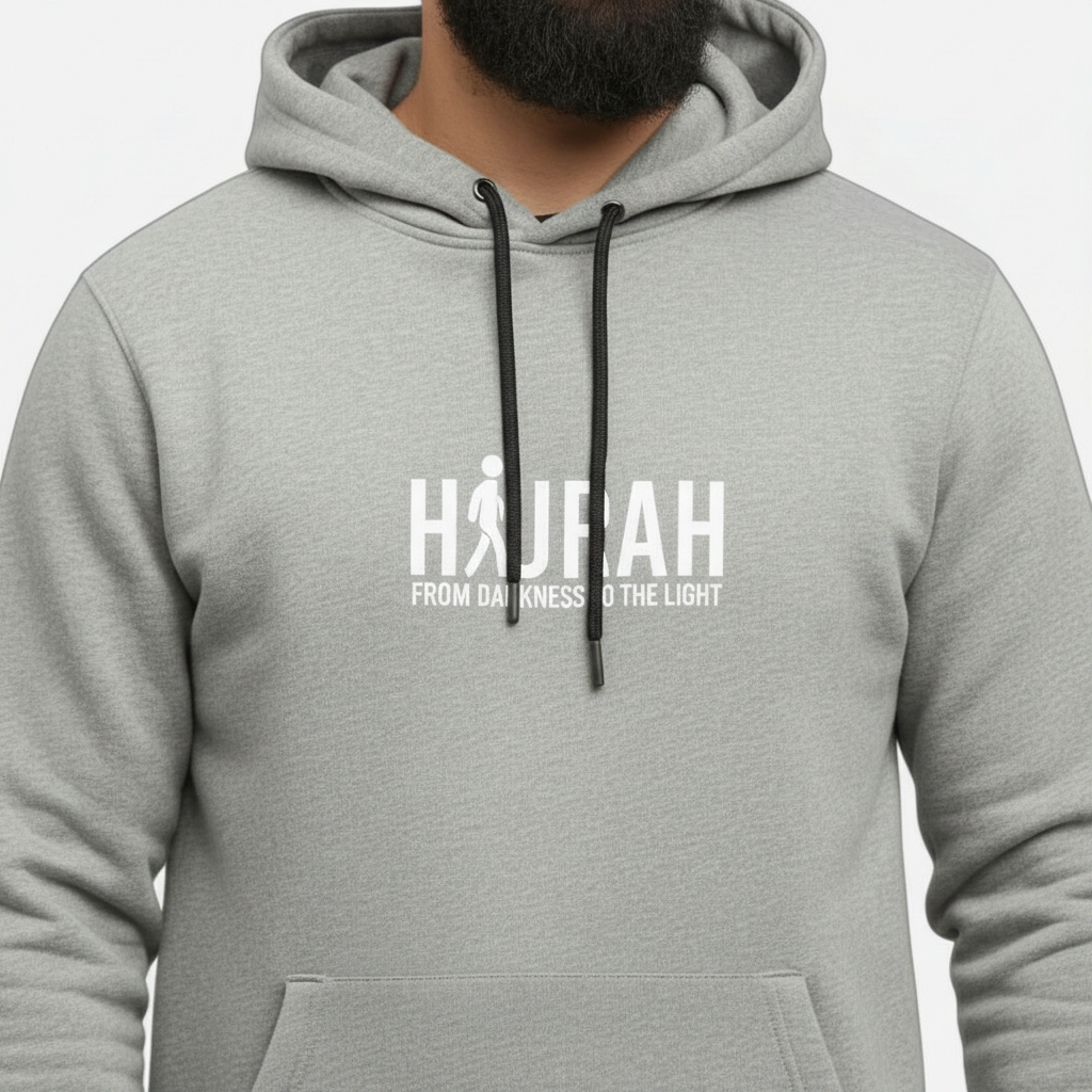 Sunnah Conscious heather grey cotton kangaroo hoodie featuring a white Hijrah From Darkness To The Light graphic.