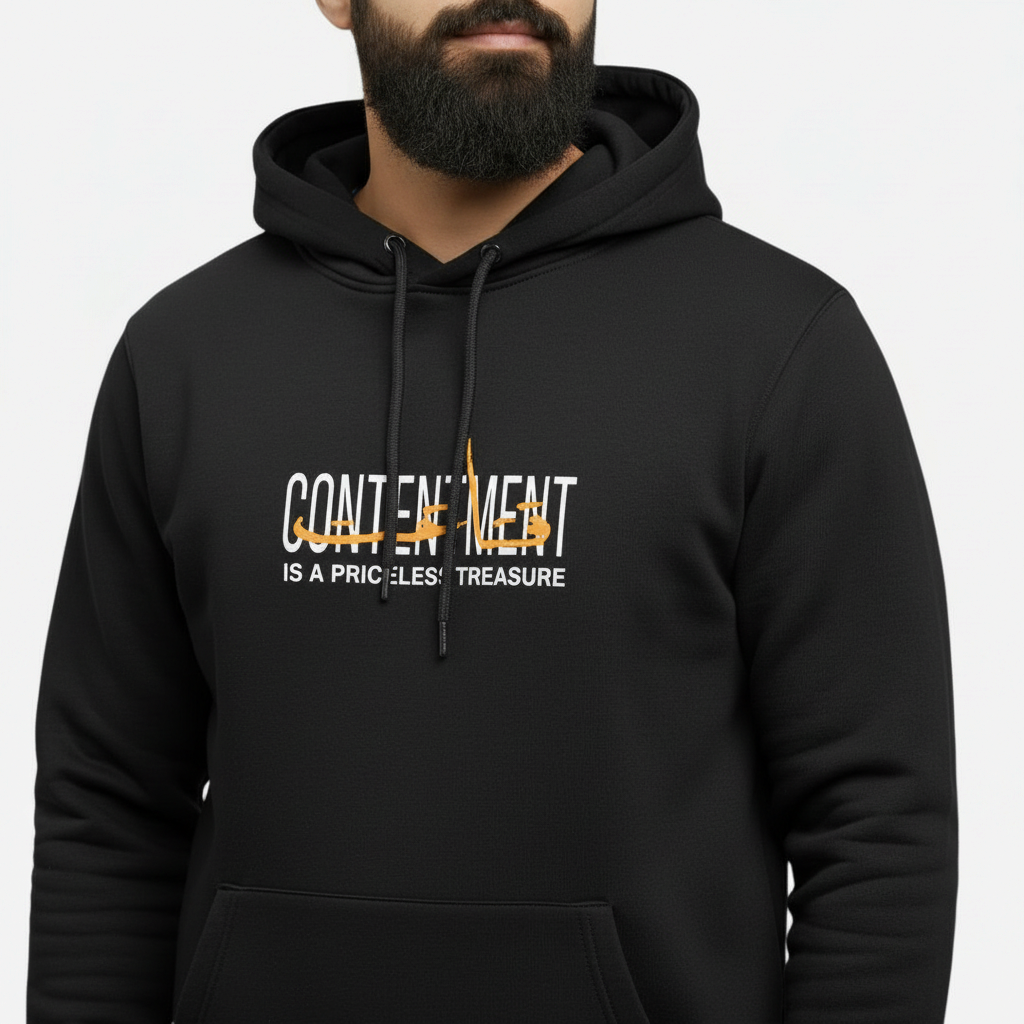 Sunnah Conscious black cotton kangaroo hoodie featuring the text Contentment is a Priceless Treasure in white and gold