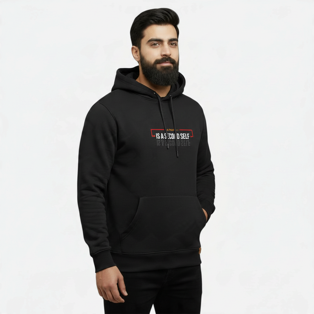 Sunnah Conscious black cotton kangaroo hoodie with A Friend is a Second Self graphic print worn by a bearded man