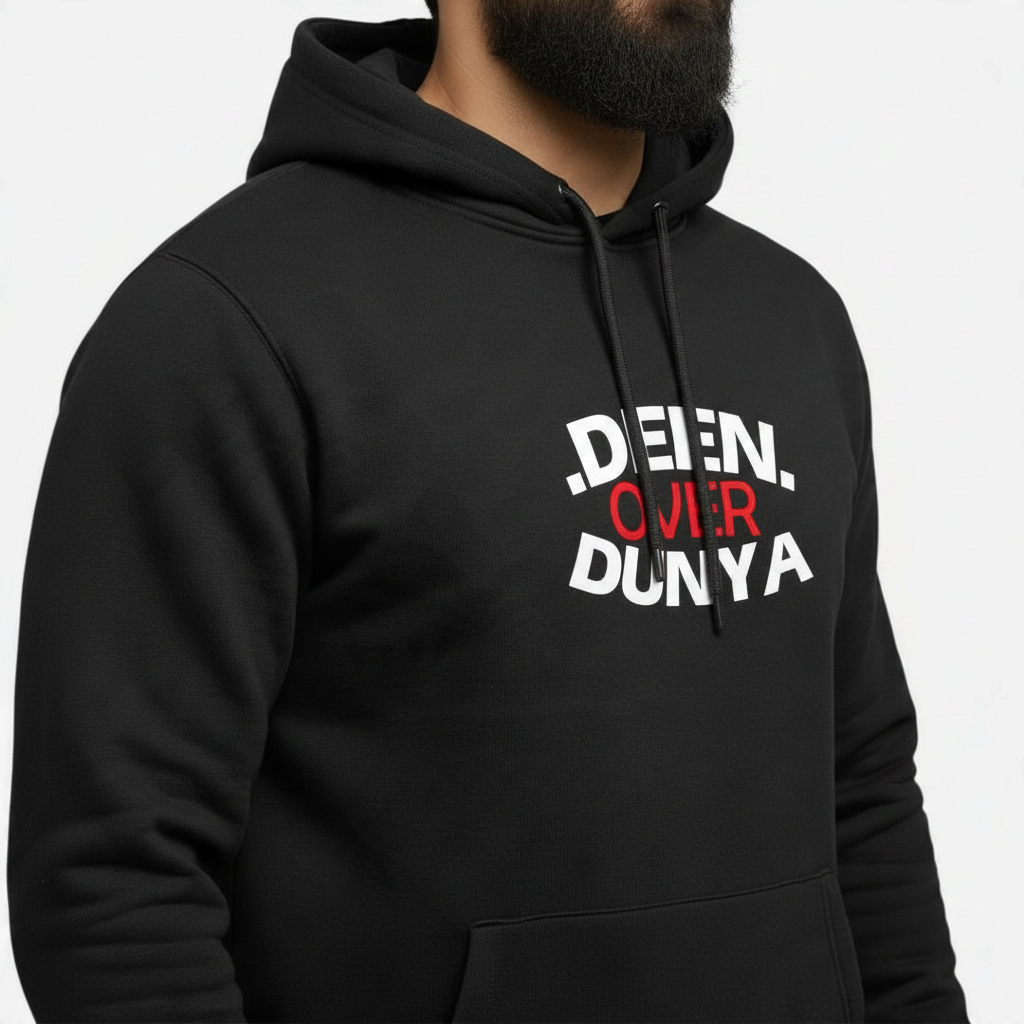 Sunnah Conscious black cotton hoodie featuring the Deen Over Dunya slogan in white and red text on a bearded man