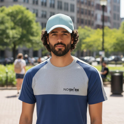 Sunnah Conscious men's blue and heather grey cotton raglan t-shirt with round neck and logo detail.