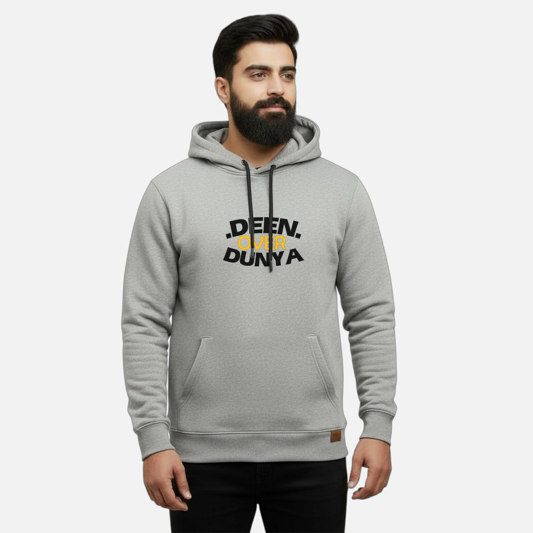 Sunnah Conscious grey cotton hoodie with Deen Over Dunya graphic print and kangaroo pocket worn by a bearded man