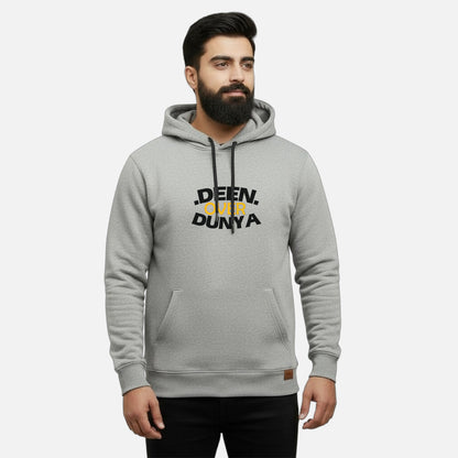 Sunnah Conscious grey cotton hoodie with Deen Over Dunya graphic print and kangaroo pocket worn by a bearded man