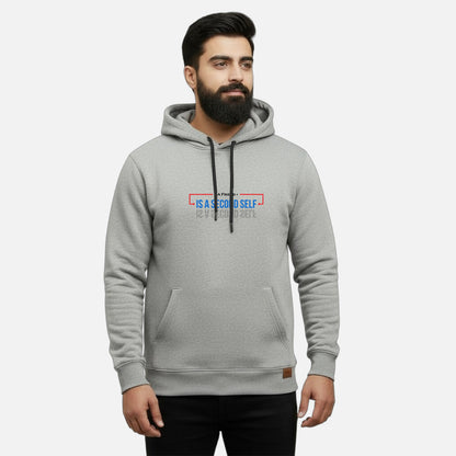 Sunnah Conscious grey cotton kangaroo hoodie worn by a bearded man featuring a unique graphic print on the chest.