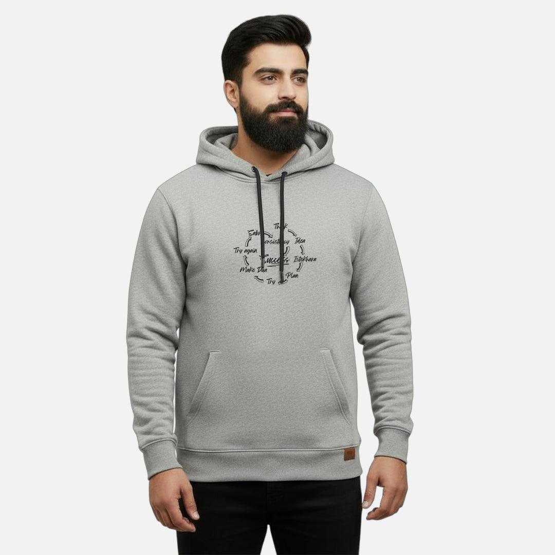 Sunnah Conscious grey cotton Success Circle kangaroo hoodie worn by a bearded man, featuring a black graphic print.