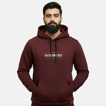 Sunnah Conscious maroon cotton hoodie with A Friend is a Second Self graphic print worn by a bearded man