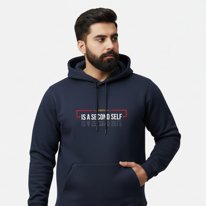 Sunnah Conscious navy blue cotton hoodie with A Friend is a Second Self graphic print worn by a bearded man