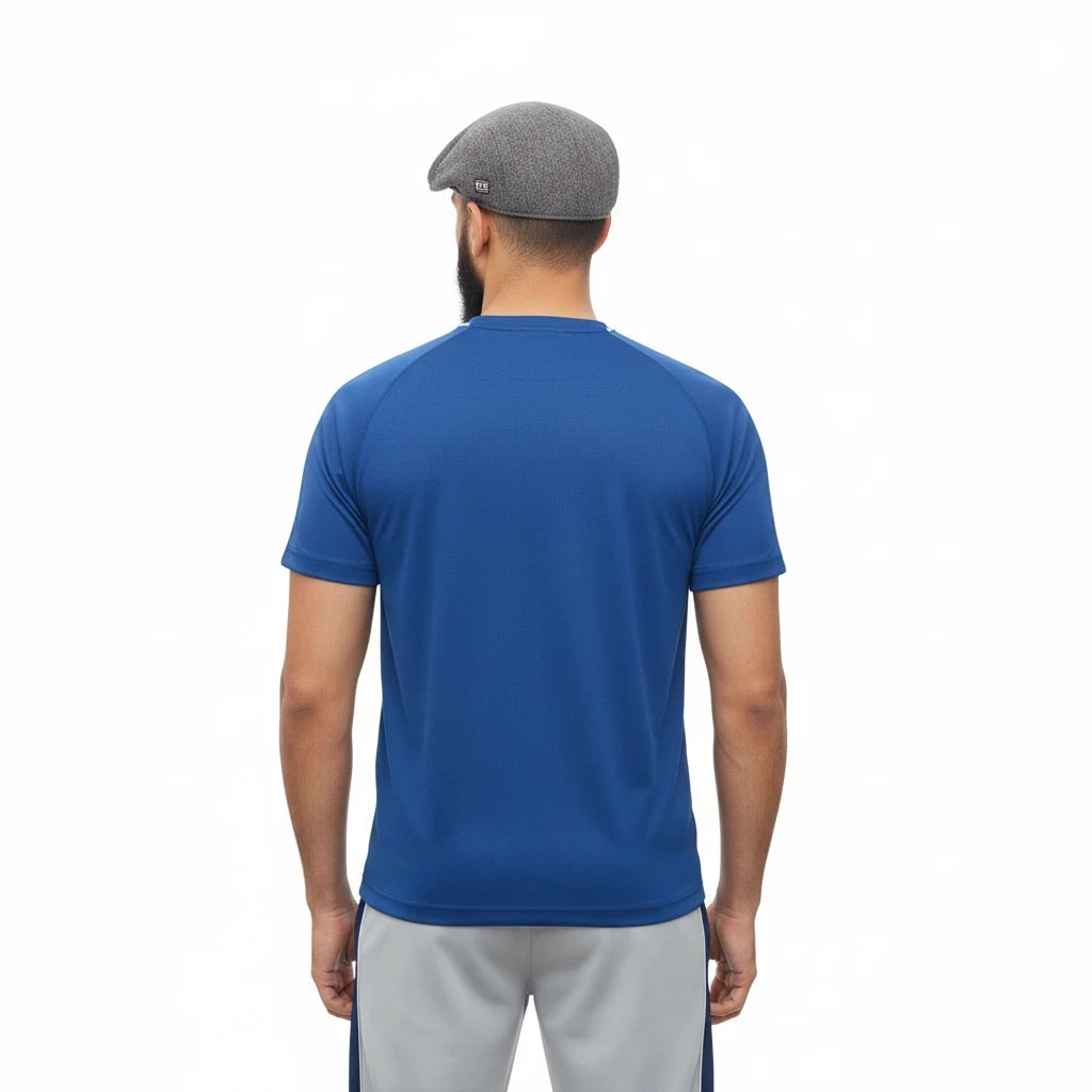 Back view of a man wearing a Sunnah Conscious navy blue cotton t-shirt and steel grey athletic shorts