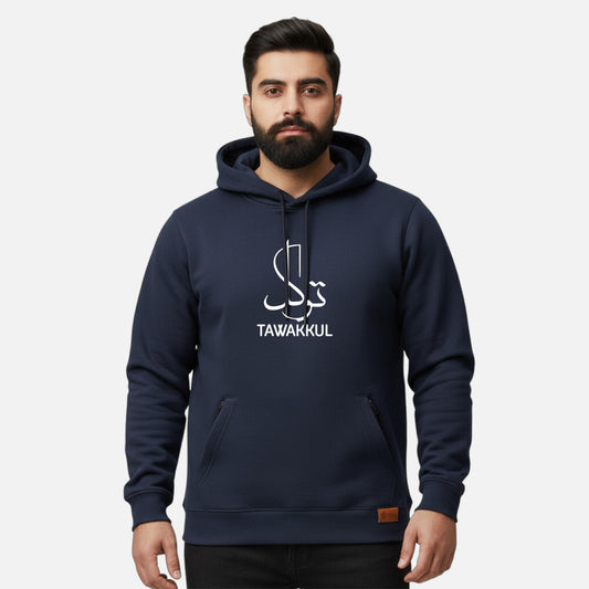 Sunnah Conscious navy blue cotton hoodie with Tawakkul calligraphy print and front kangaroo pocket worn by a man