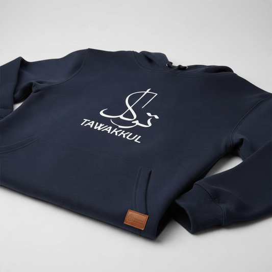 Sunnah Conscious navy blue cotton hoodie featuring white Tawakkul calligraphy and a front kangaroo pocket.