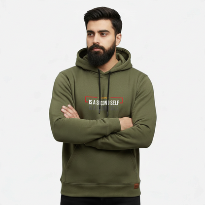Sunnah Conscious olive green cotton hoodie with A Friend is a Second Self graphic print worn by a bearded man