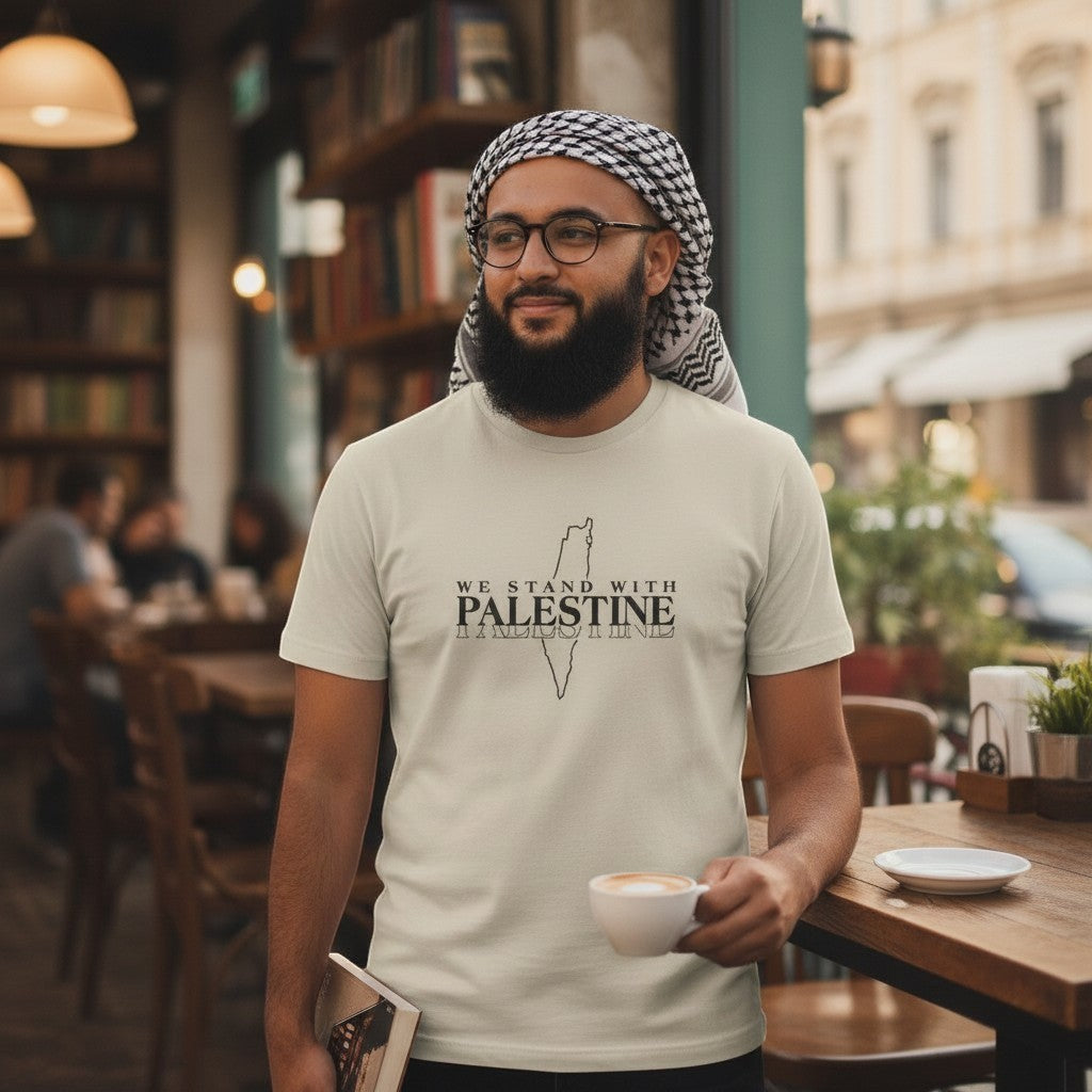 Sunnah Conscious light beige dry fit t-shirt with "We Stand with Palestine" graphic. Model wears keffiyeh and glasses.